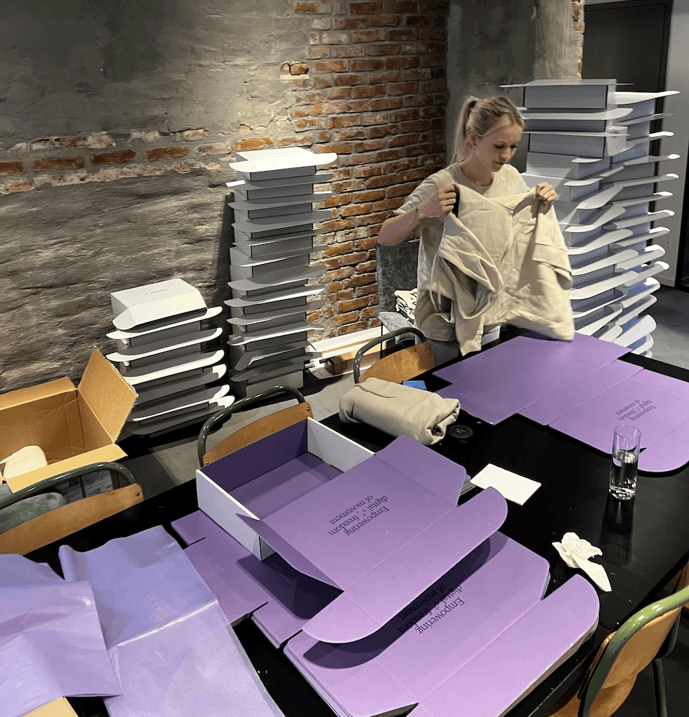 Employee enjoying mandatory fun box wrapping